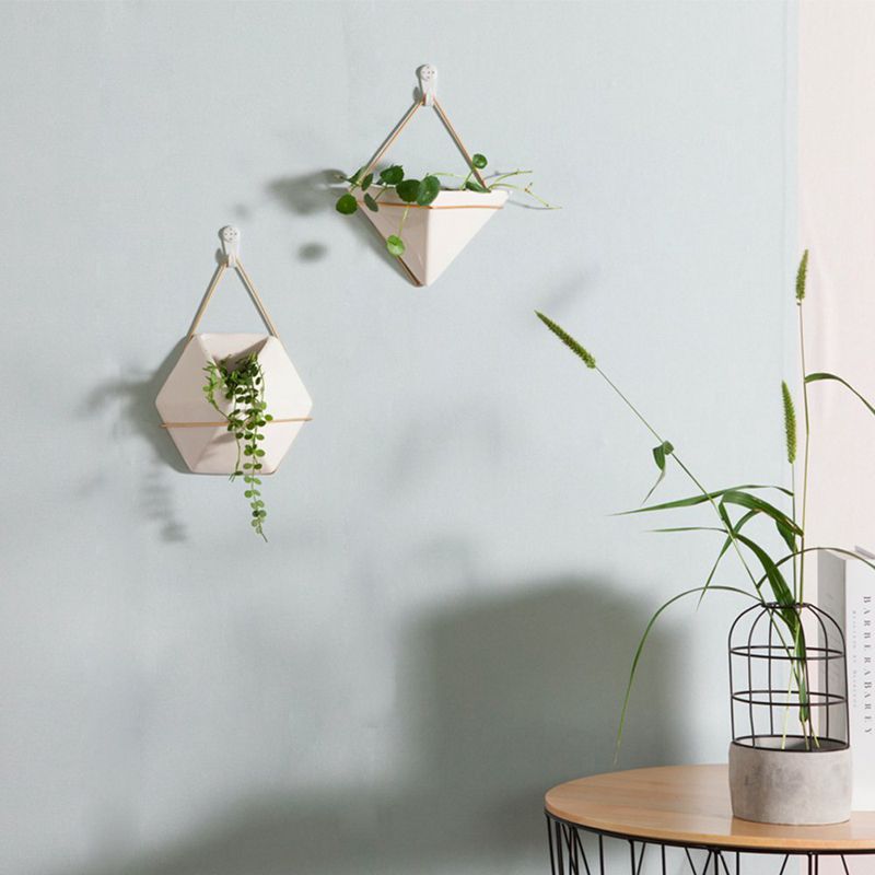 white ceramic plant pots with metal wire hanger