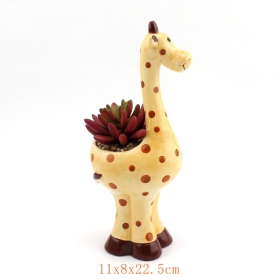 Planteur de girafe en céramique mignon rempli de fleurs